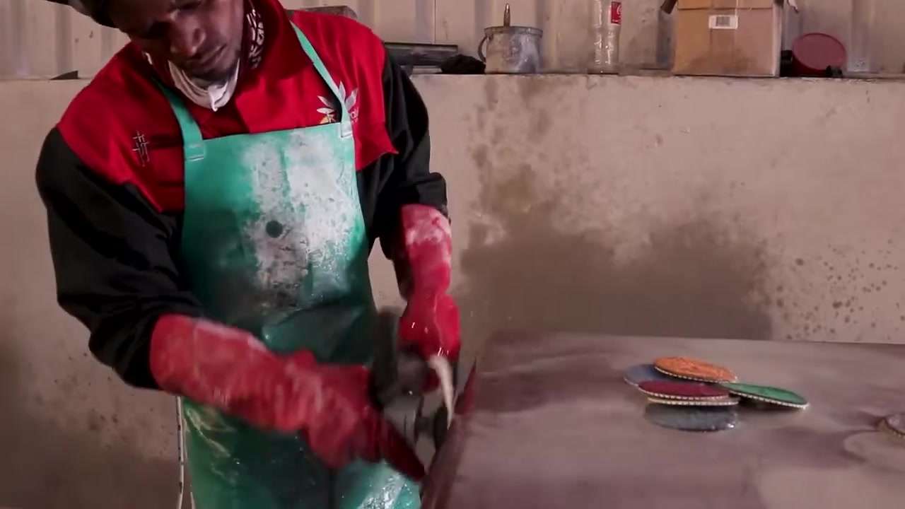 Hand polishing granite at the Thabaletsi Nkowankowa factory